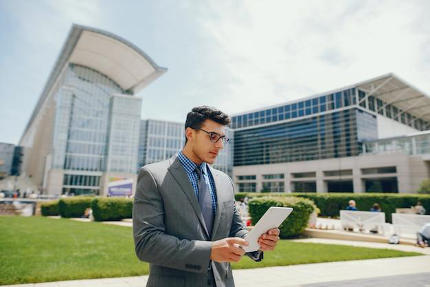 businessman reading on an iPad
