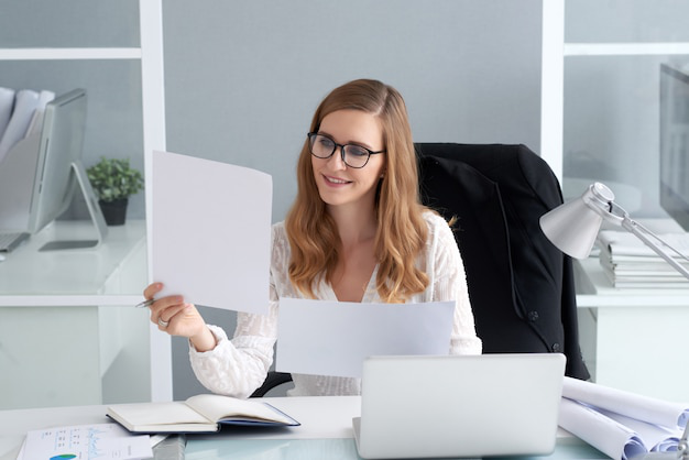 woman looking at paperwork