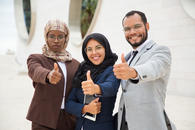 professionals giving a thumbs up