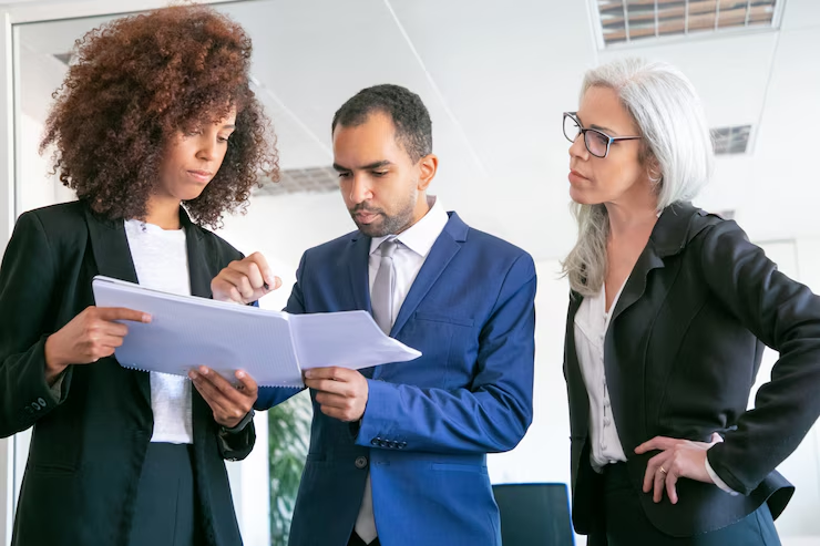 professionals reviewing attested company documents before Qatar submission