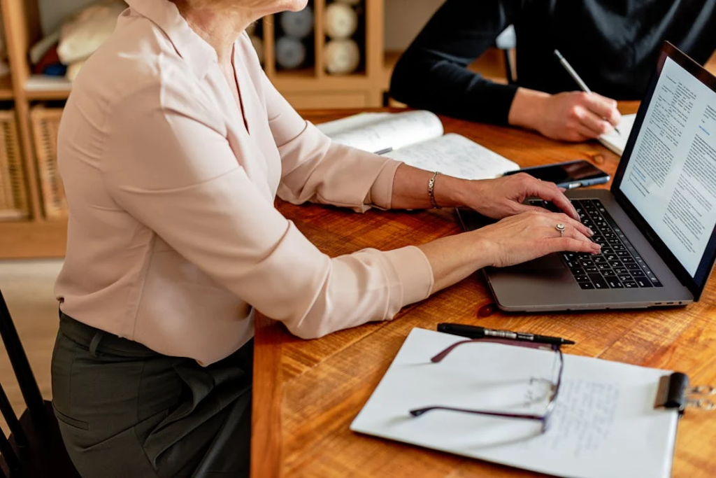 specialist reviewing Australian attestation documents on a laptop