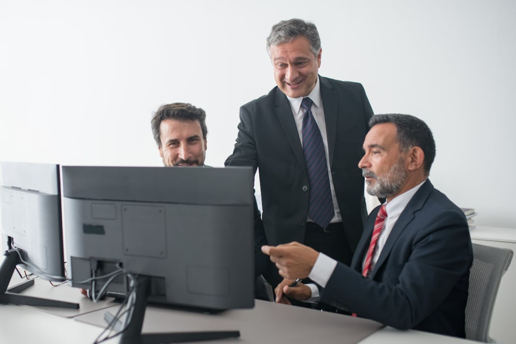 professionals looking at a computer screen