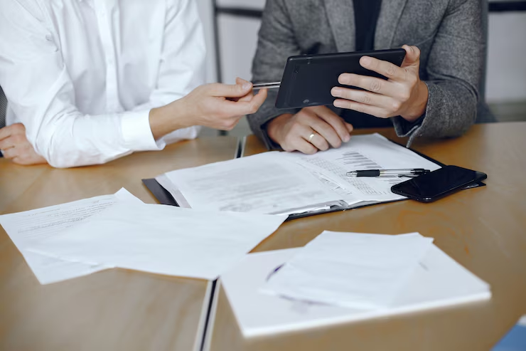Embassy official reviewing academic credentials for Qatar document attestation