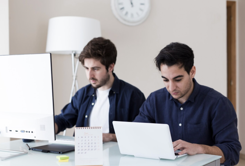 Australian business owners in a modern office, planning their company's expansion into the UAE.