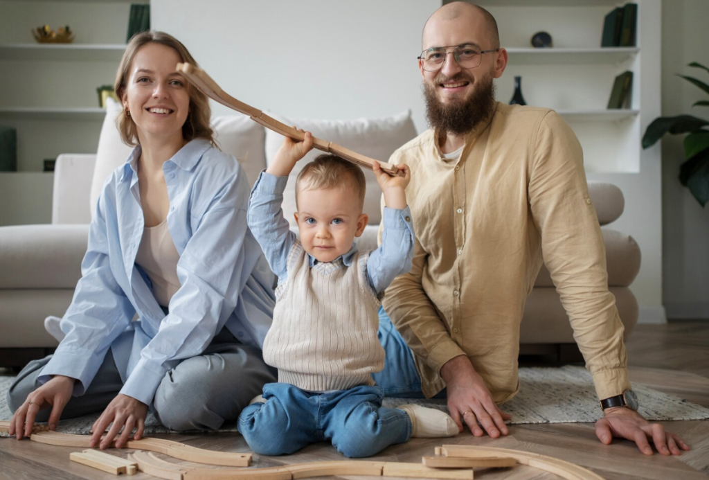 A happy family of three, with a mother, father, and young child, posing in the living room of their modern home, representing families preparing for a move.