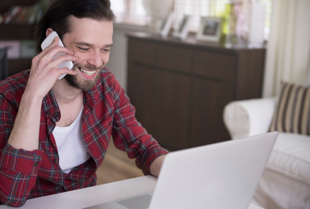 A man on the phone, receiving expert guidance from an Authentifier representative.