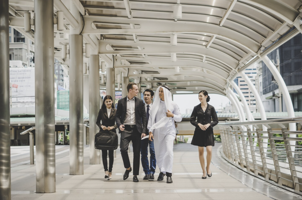 Business partners walking and discussing a corporate project.