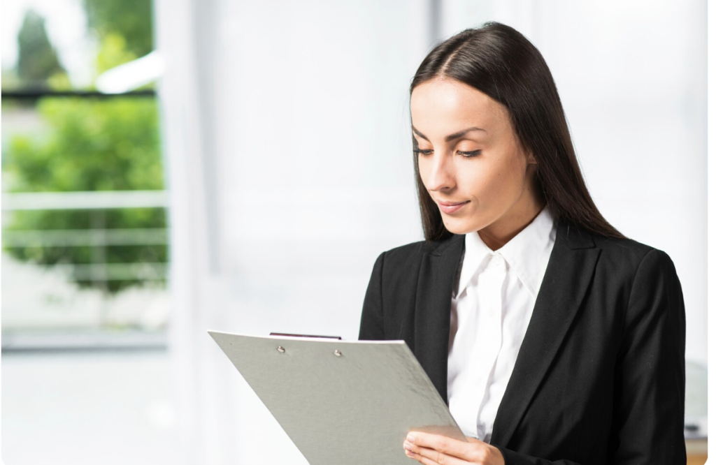 A document attestation expert reviewing paperwork and documents.